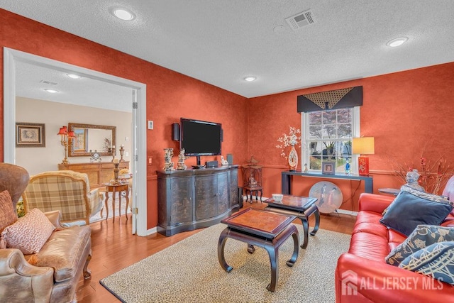 539 Old Nassau Rd Unit B, Monroe, NJ 08831 - living room with wood finished floors, a textured ceiling, recessed lighting, and baseboards