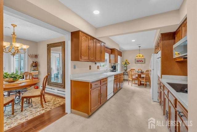 539 Old Nassau Rd Unit B, Monroe, NJ 08831 - kitchen with stainless steel microwave, dishwasher, brown cabinets, light countertops, and black electric cooktop