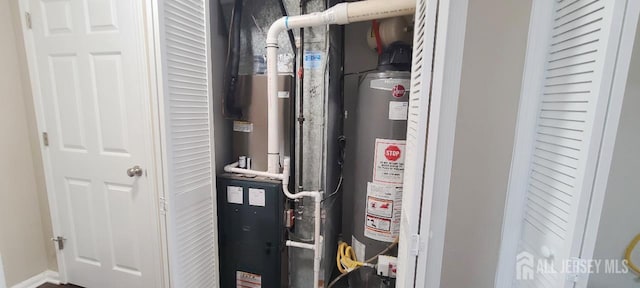 110 Jefferson St, Perth Amboy, NJ 08861 - utility room featuring gas water heater