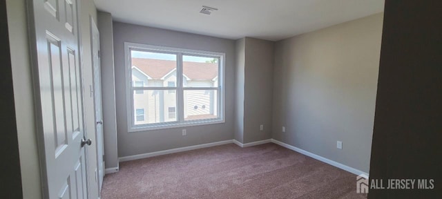 110 Jefferson St, Perth Amboy, NJ 08861 - spare room featuring carpet floors and baseboards