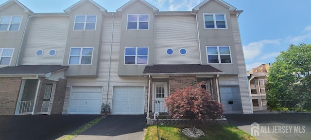 110 Jefferson St, Perth Amboy, NJ 08861 - view of property with a garage and driveway