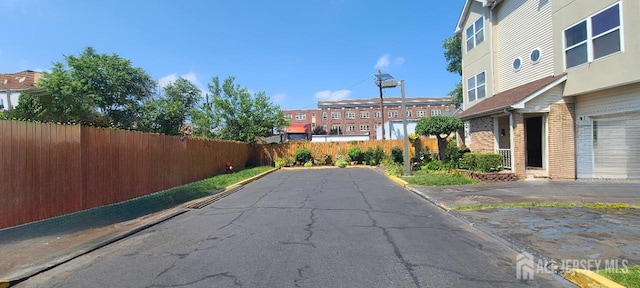 110 Jefferson St, Perth Amboy, NJ 08861 - view of asphalt road featuring curbs