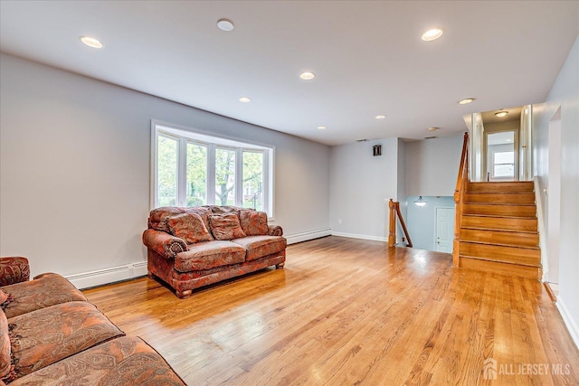 878 Beatrice Pkwy, Edison, NJ 08820 - living area with a baseboard heating unit, light wood-style floors, recessed lighting, and baseboards