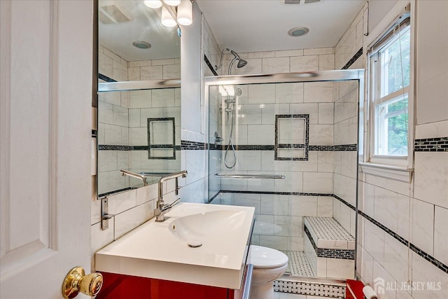 878 Beatrice Pkwy, Edison, NJ 08820 - full bathroom with tile walls, toilet, vanity, and a shower stall