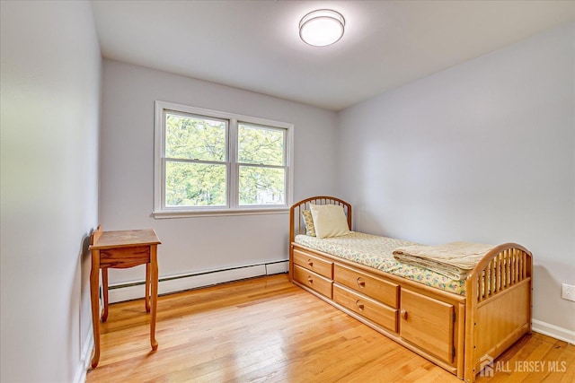 878 Beatrice Pkwy, Edison, NJ 08820 - bedroom with a baseboard heating unit, light wood-style flooring, and baseboards