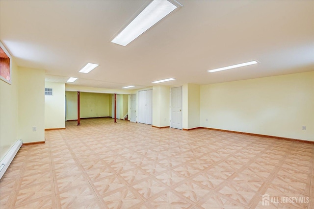 878 Beatrice Pkwy, Edison, NJ 08820 - finished basement featuring a baseboard heating unit, baseboards, and light flooring