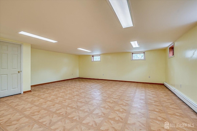 878 Beatrice Pkwy, Edison, NJ 08820 - below grade area with baseboard heating, baseboards, and light floors