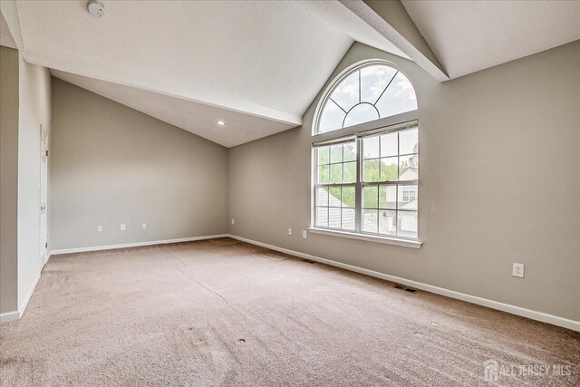 922 Thomas Ave, North Brunswick, NJ 08902 - carpeted empty room with lofted ceiling, baseboards, and a smoke detector