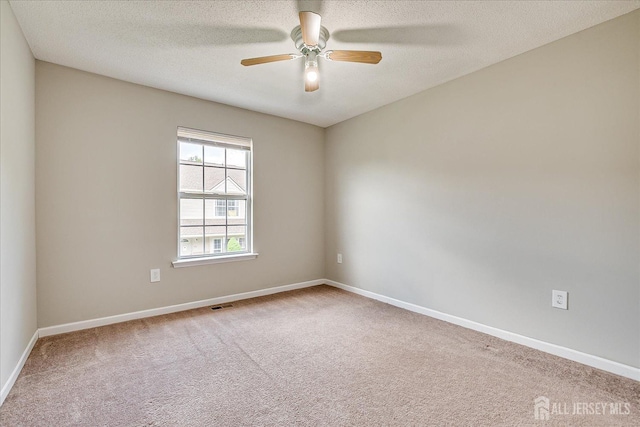 922 Thomas Ave, North Brunswick, NJ 08902 - empty room featuring carpet flooring, baseboards, a ceiling fan, and a textured ceiling