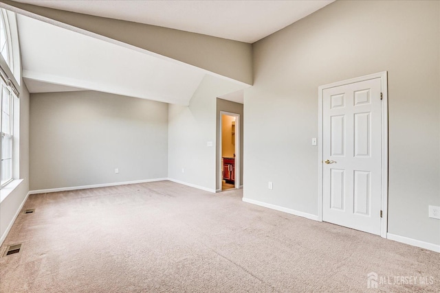 922 Thomas Ave, North Brunswick, NJ 08902 - carpeted spare room with baseboards and high vaulted ceiling