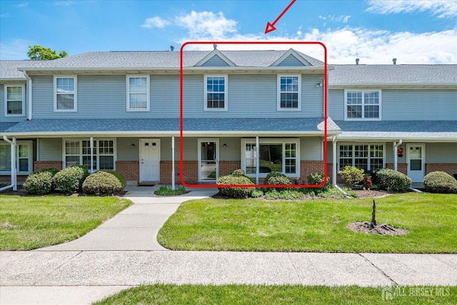 922 Thomas Ave, North Brunswick, NJ 08902 - view of property with brick siding and a front lawn