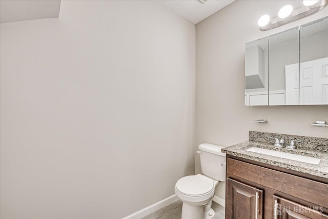 922 Thomas Ave, North Brunswick, NJ 08902 - bathroom with baseboards, vanity, toilet, and tile patterned floors