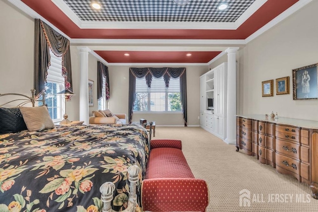 carpeted bedroom with ornamental molding and ornate columns