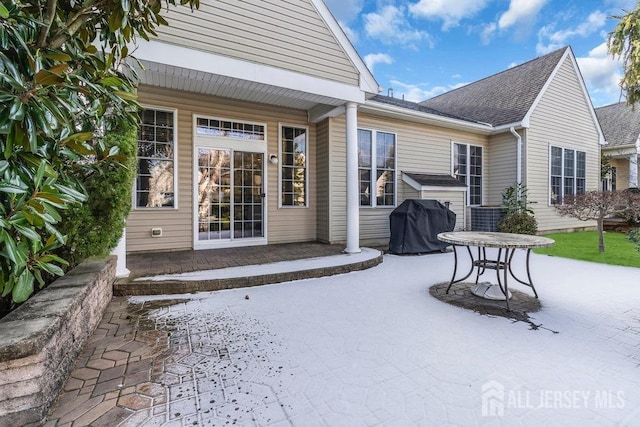 view of patio featuring a grill