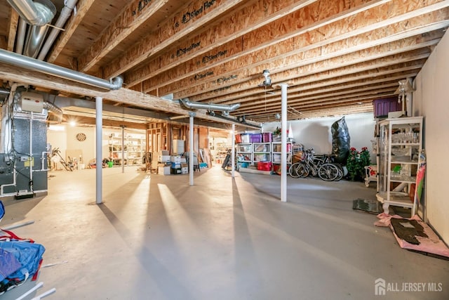 basement featuring heating unit