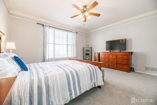 carpeted bedroom with crown molding and ceiling fan