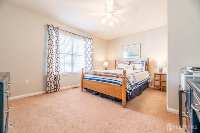 bedroom featuring light carpet and ceiling fan