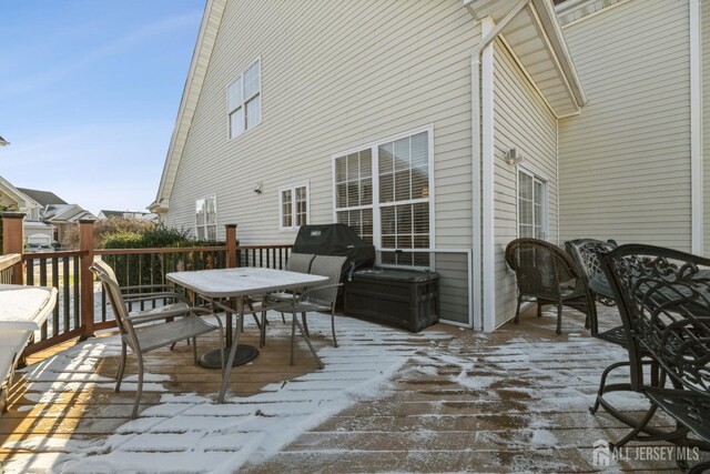 view of snow covered deck