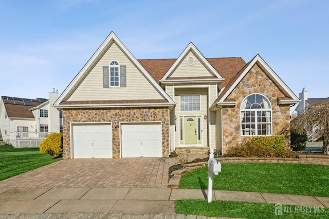 front of property featuring a garage and a front yard