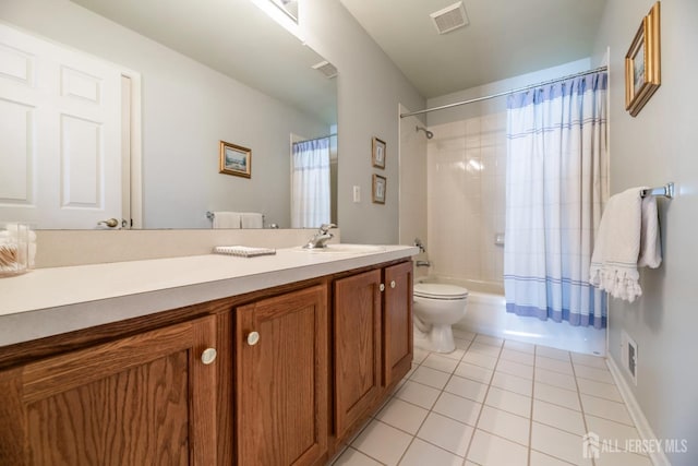 full bathroom with shower / tub combo with curtain, vanity, tile patterned flooring, and toilet