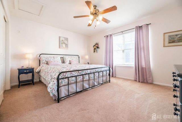 bedroom featuring light carpet and ceiling fan