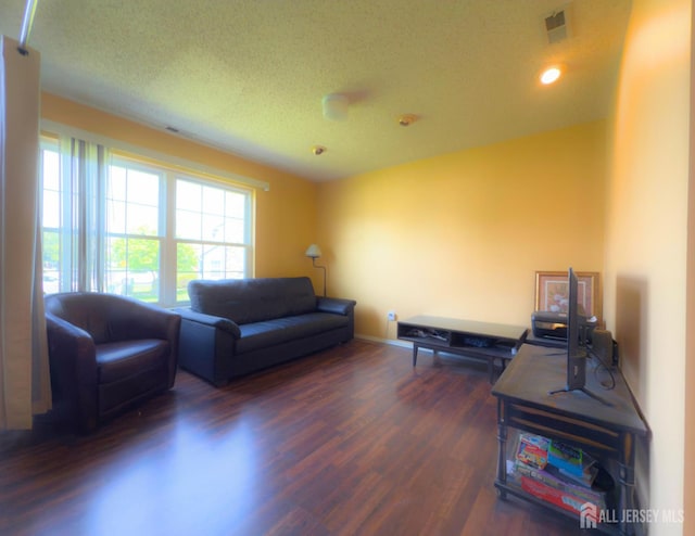 67 Nova Dr, Piscataway, NJ 08854 - living area with wood finished floors, recessed lighting, a textured ceiling, and baseboards