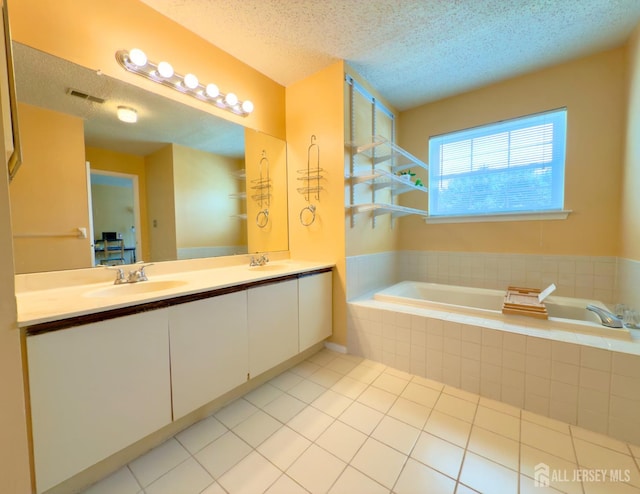 67 Nova Dr, Piscataway, NJ 08854 - full bath featuring a bath, a textured ceiling, tile patterned flooring, and double vanity