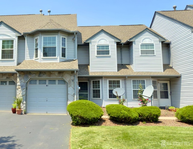 67 Nova Dr, Piscataway, NJ 08854 - multi unit property with driveway, an attached garage, and a shingled roof