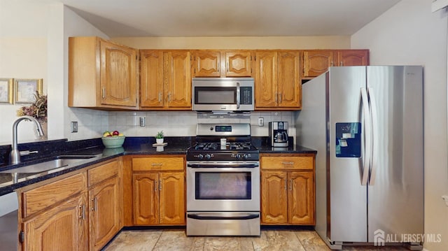 1014 Hemlock Ct, South Brunswick, NJ 08852 - kitchen featuring appliances with stainless steel finishes, a sink, tasteful backsplash, and brown cabinets