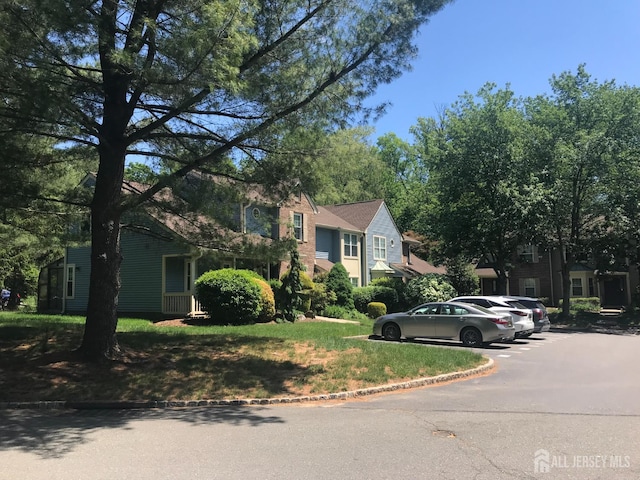 1014 Hemlock Ct, South Brunswick, NJ 08852 - view of property hidden behind natural elements with uncovered parking and a front lawn