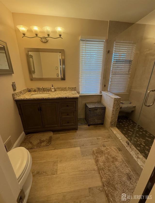 1014 Hemlock Ct, South Brunswick, NJ 08852 - bathroom with a stall shower, wood finished floors, and vanity