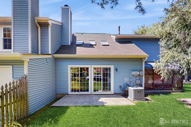 1014 Hemlock Ct, South Brunswick, NJ 08852 - rear view of property featuring central air condition unit, a patio, a chimney, and a shingled roof
