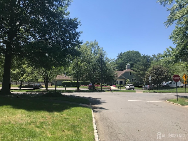 1014 Hemlock Ct, South Brunswick, NJ 08852 - view of asphalt street featuring traffic signs and curbs