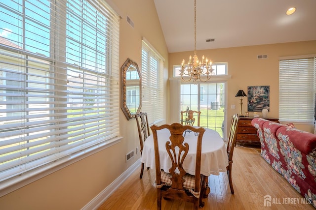 9 Copernicus Ct, East Windsor, NJ 08512 - dining space with a chandelier, light wood-type flooring, and high vaulted ceiling