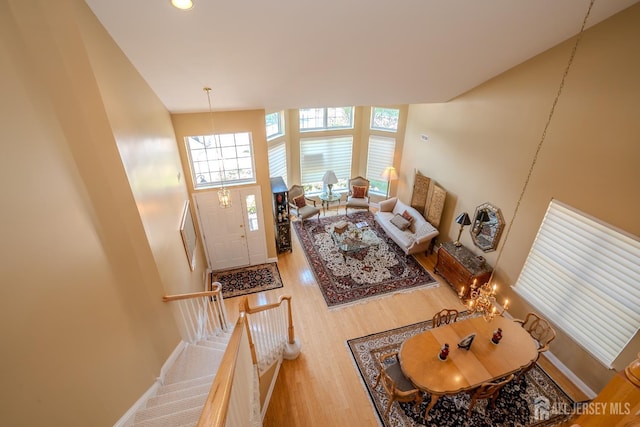 9 Copernicus Ct, East Windsor, NJ 08512 - living area with a high ceiling, wood finished floors, healthy amount of natural light, recessed lighting, and a chandelier