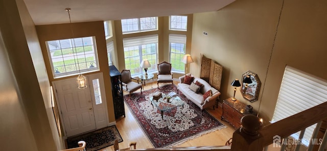 9 Copernicus Ct, East Windsor, NJ 08512 - living area featuring wood finished floors and a towering ceiling