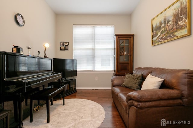 living room with wood finished floors and baseboards