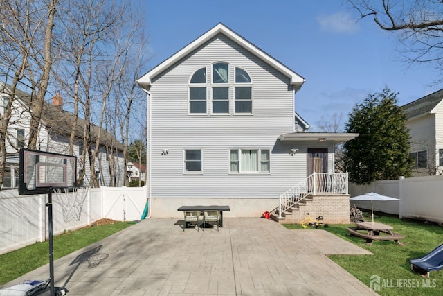rear view of property with a patio