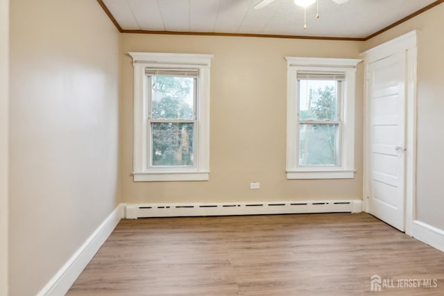 113 Coleman St, Middlesex, NJ 08846 - empty room featuring ornamental molding, baseboard heating, light wood finished floors, ceiling fan, and baseboards
