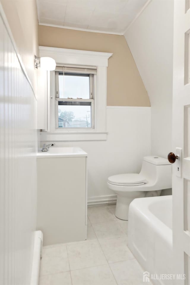 113 Coleman St, Middlesex, NJ 08846 - bathroom featuring toilet, tile patterned floors, vaulted ceiling, and a sink