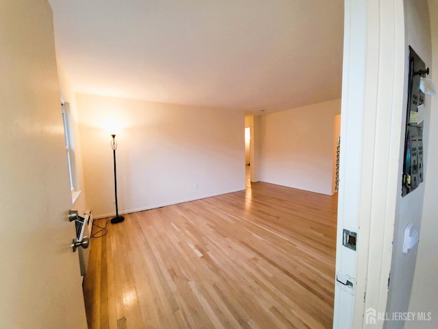 spare room with light wood finished floors