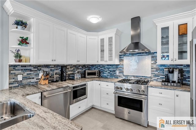 1109 Enclave Cir, Franklin, NJ 08873 - kitchen featuring open shelves, wall chimney range hood, white cabinetry, light stone counters, and appliances with stainless steel finishes
