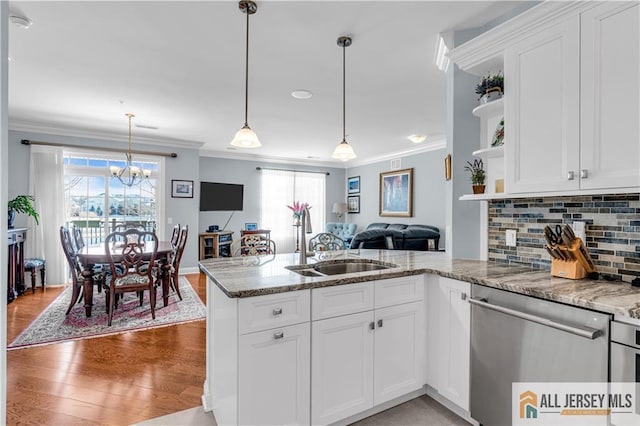 1109 Enclave Cir, Franklin, NJ 08873 - kitchen with a peninsula, open shelves, ornamental molding, and dishwasher