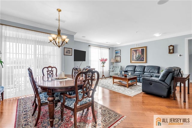 1109 Enclave Cir, Franklin, NJ 08873 - dining area featuring crown molding, visible vents, a chandelier, and light wood finished floors