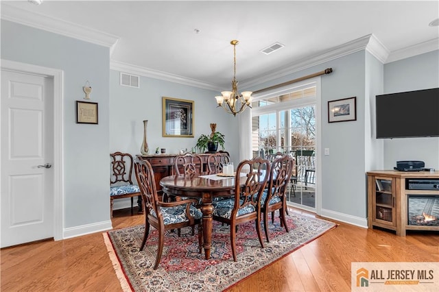 1109 Enclave Cir, Franklin, NJ 08873 - dining room featuring visible vents, baseboards, and crown molding