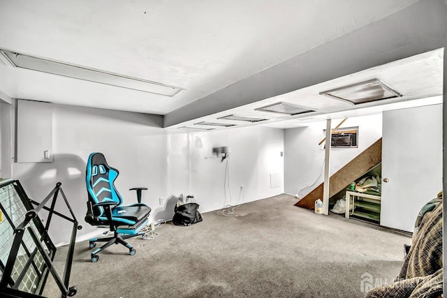 exercise area with attic access, carpet floors, and a wall unit AC