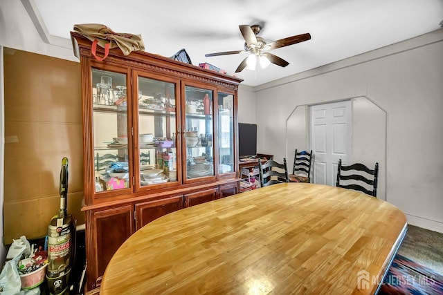 dining space featuring a ceiling fan
