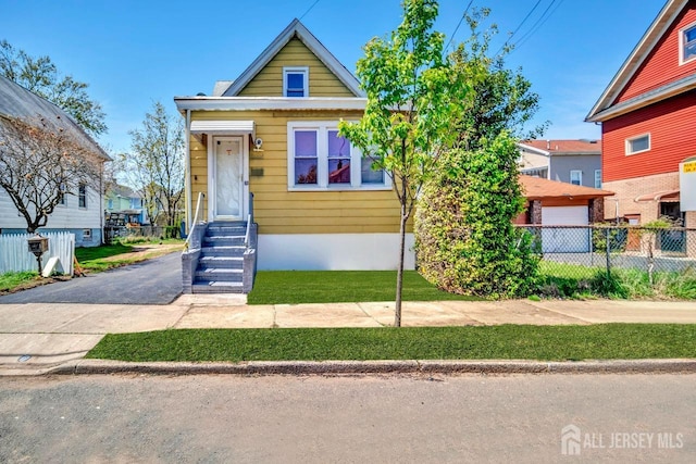 view of front of house with fence