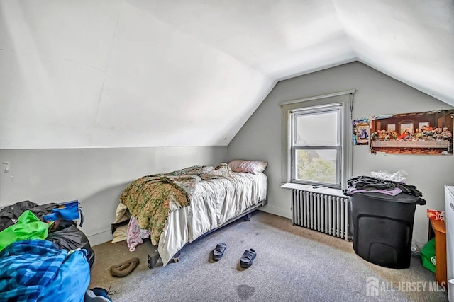 carpeted bedroom featuring radiator and vaulted ceiling