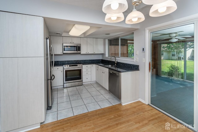 249 Doremus Dr Unit B, Monroe, NJ 08831 - kitchen with appliances with stainless steel finishes, a sink, plenty of natural light, and white cabinets